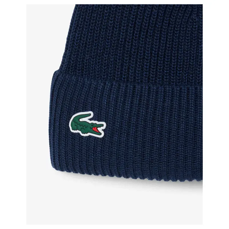 Lacoste – Bonnet de golf laine mélangée avec pompon