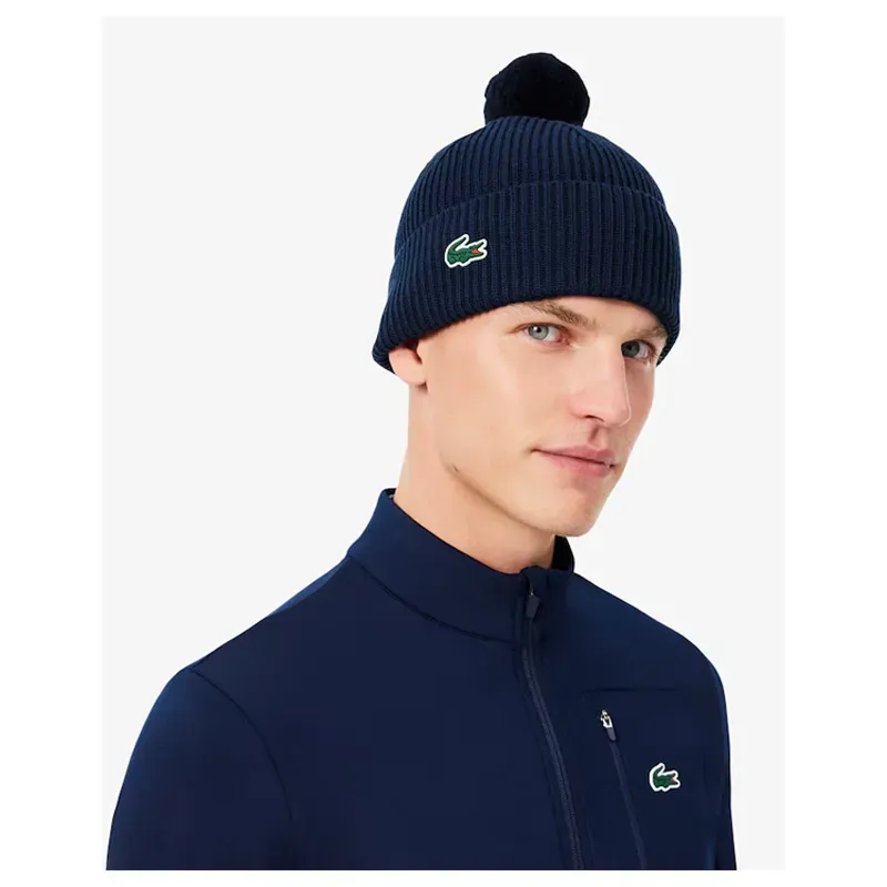 Lacoste – Bonnet de golf laine mélangée avec pompon